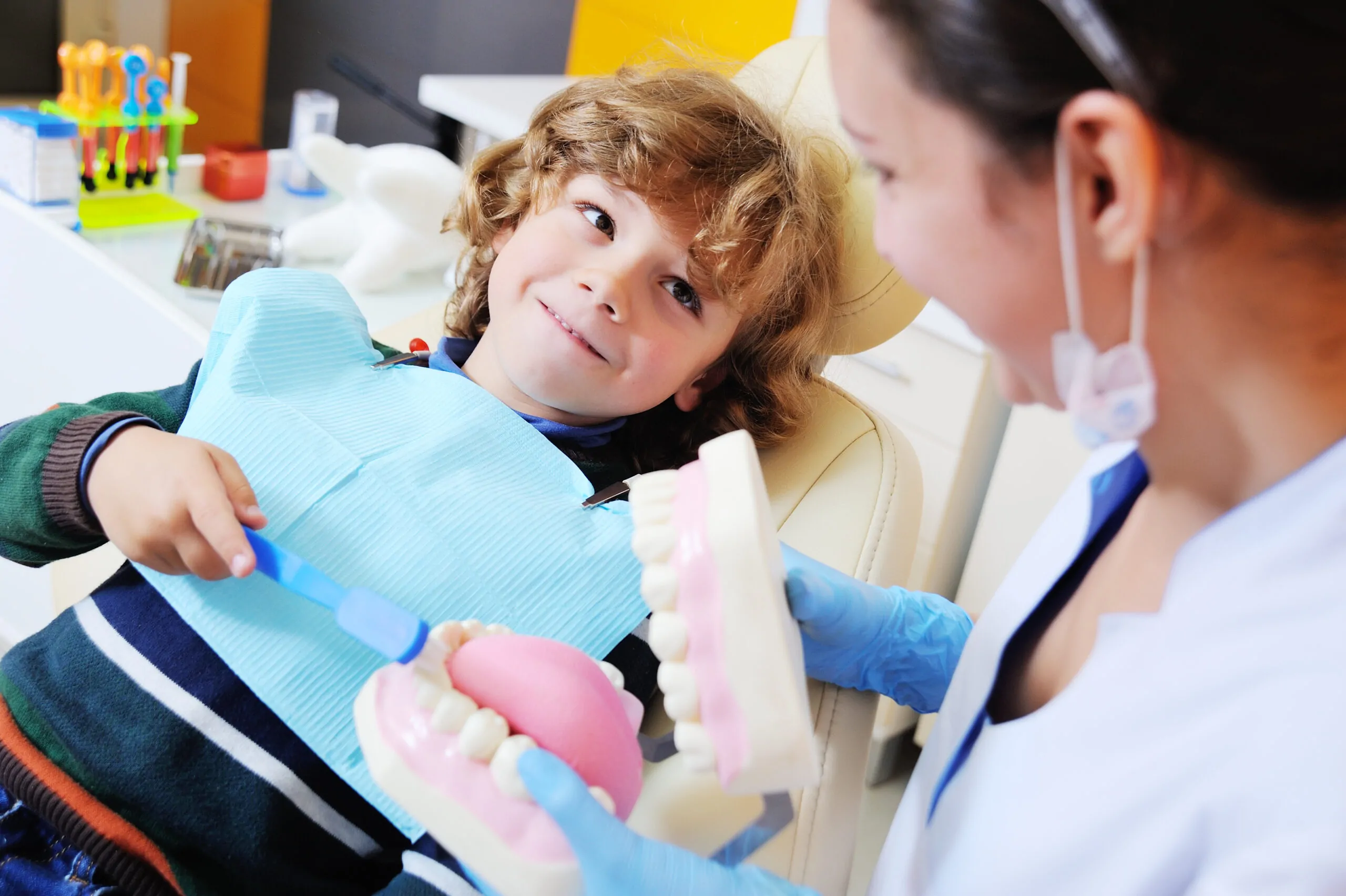 Dentist helping a child